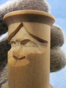 Use the 10mm #11 to narrow the face at the eye line and a knife to smooth the ridges at the temple.