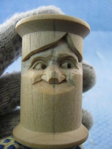 I take the easy way out on these tiny eyes by just making a negative space for the iris/pupil. For this face, a 2mm #9 just fits between the upper and lower lids. Push straight in and avoid nicking the lids. I use the point of my knife and sometimes a 1.5 mm #9 to remove the wood and create the shadow. 