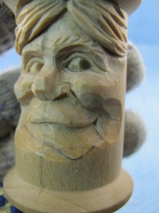 Use a V-tool to remove wood under the lip line. Use a knife to trace a stop cut into the v-cut and continue removing more wood below the lip.