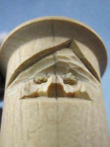 I taper the nose to resemble a tent. Notice in the picture the bridge of the nose retains a flat area. The nose is small and could break easily, so I carefully use a knife. For a nose this size, I used a 3mm #9 gouge to remove wood from the front of the wings continuing up the sides of the nose into the corner of the eye.