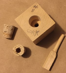 Block, push stick and corks.